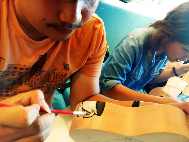 Painting a ukulele at UkeHUB Kafe in Mactan Island Lapulapu City Cebu Philippines